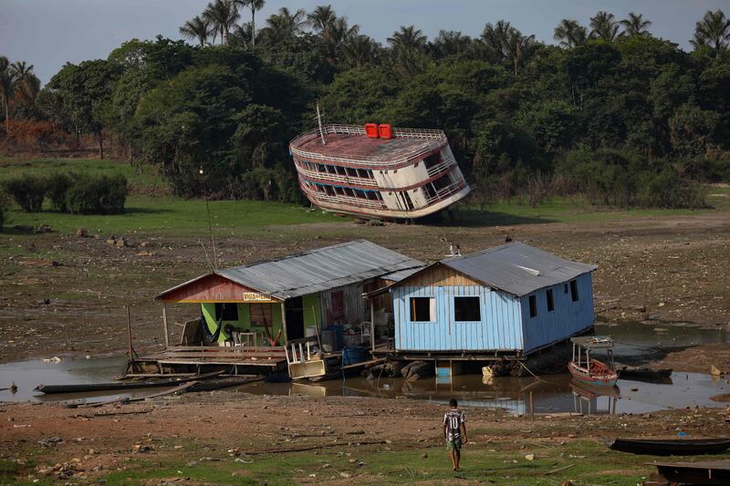 Houseboats and a stranded boat on the Rio Negro, Amazonas, Brazil. AFP
