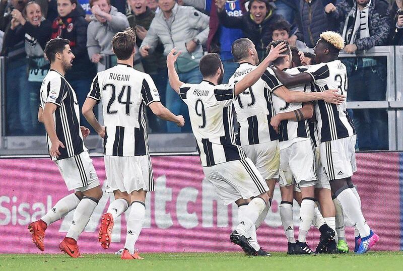 Juventus players celebrate a last-gasp win against AC Milan in their Serie A encounter at Juventus Stadium in Torino on March 10, 2017. Alessandro di Marco / EPA
