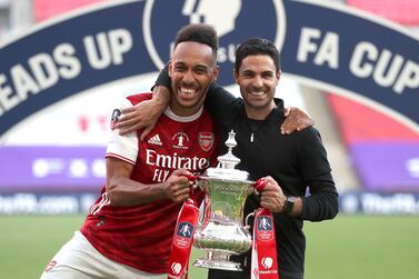 Arsenal coach Mikel Arteta and striker Pierre-Emerick Aubameyang with the FA Cup after the victory over Chelsea at Wembley. AP