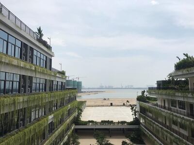 The Shattuck-St Mary's School Forest City campus overlooks ongoing construction and the Port of Tanjung Pelepas in Johor, Malaysia, August 20, 2018. Picture taken August 20, 2018.      REUTERS/Fathin Ungku