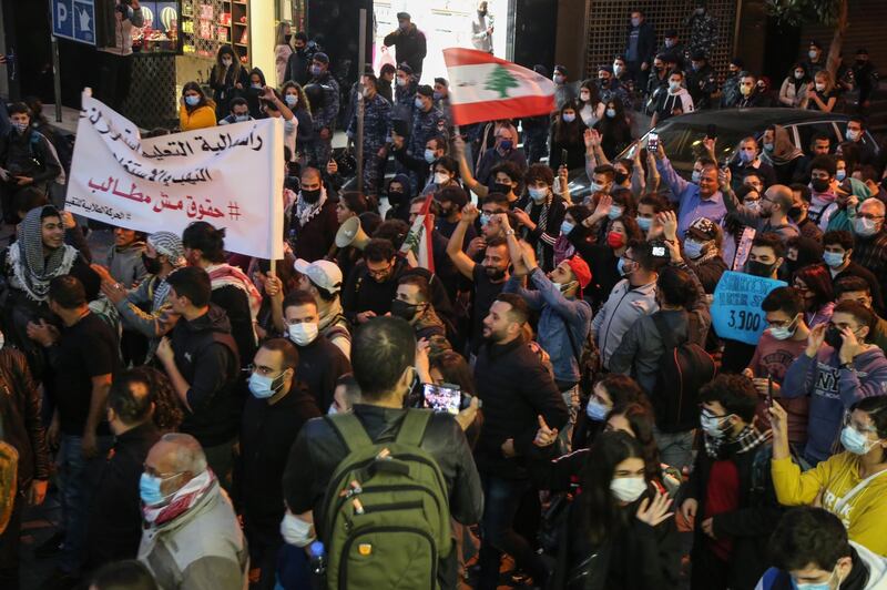 Students from different universities carry placards, wave Lebanese flags during a demonstration under the slogan of 'A Day of Student Rage' in Al-Hamra, Beirut. EPA