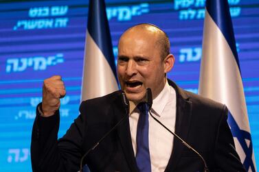Israeli politician Naftali Bennett, leader of the right wing 'New Right' party, speaks to his supporters after first exit poll results for the Israeli Parliamentary election at his party's headquarters in Petah Tikva, Israel, Wednesday, March. 24, 2021. Bennett's Yamina emerged as a possible kingmaker according to exit polls. Bennett has not committed to either the pro-Netanyahu or anti-Netanyahu camps, meaning he could play a key role in choosing the next prime minister. (AP Photo/Tsafrir Abayov)