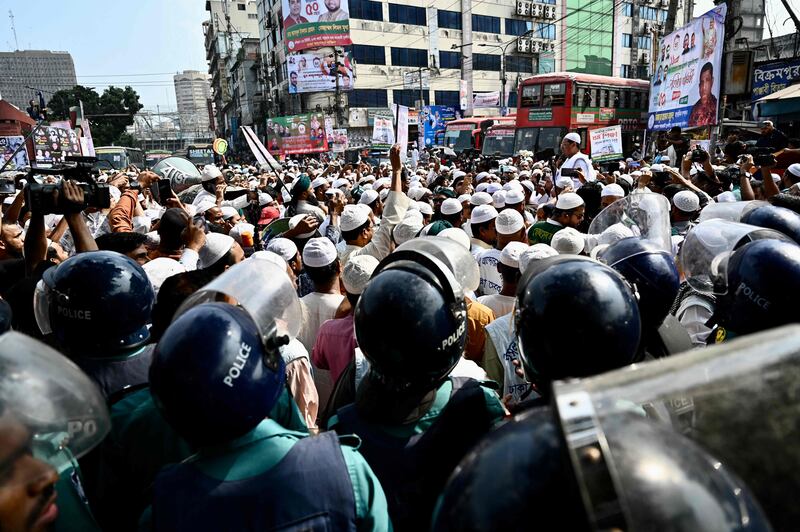 Police block Islami Andolan Bangladesh activists marching during a protest demanding compulsory Islamic education in the national education curriculum in Dhaka. AFP