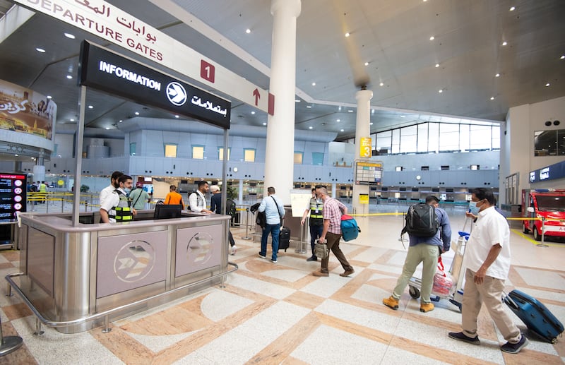 Passengers arrive at Kuwait International Airport. EPA