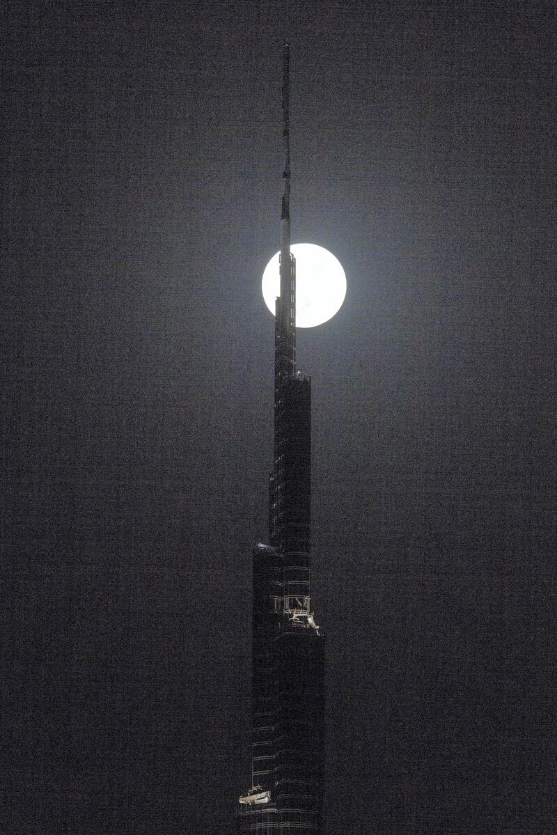 Dubai, United Arab Emirates, August 7, 2017:    A full moon rises above the Burj Khalifa in the Emaar Square area of Dubai on August 7, 2017. Christopher Pike / The National

Reporter:  N/A
Section: News