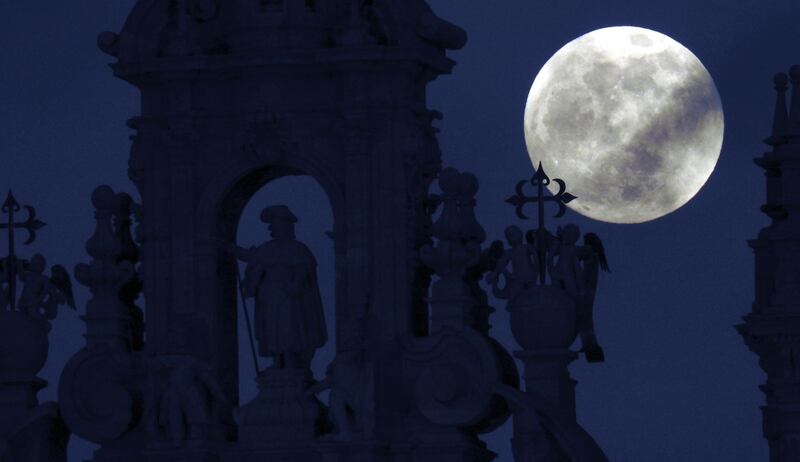 The full moon rises over the St James statue in the Cathedral of Santiago de Compostela, Galicia, northern Spain. EPA