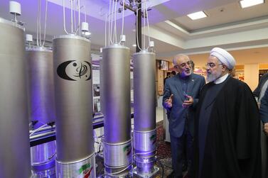 Iranian President Hassan Rouhani and the head of Iran nuclear technology organisation Ali Akbar Salehi inspect technology during Iran National Nuclear Technology Day in Tehran, 9 April 2019. EPA