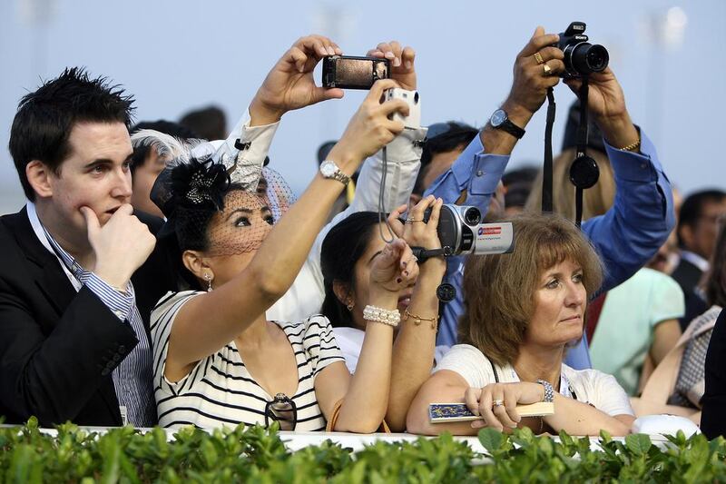 Horse racing fans photograph Khawlah in Parade Ring at Meydan Racecourse in 2011. (Pawan Singh/The National)
