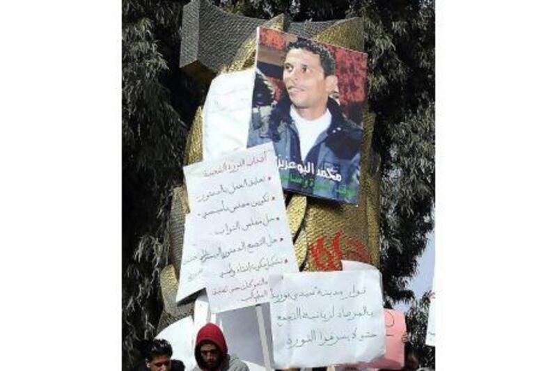 In January people gathered to demonstrate around a portrait of Tunisian protest hero Mohamed Bouazizi in Sidi Bouzid. Five Arab Spring activists, among them Bouazizi, won the Sakharov rights prize, the European Parliament announced Thursday.