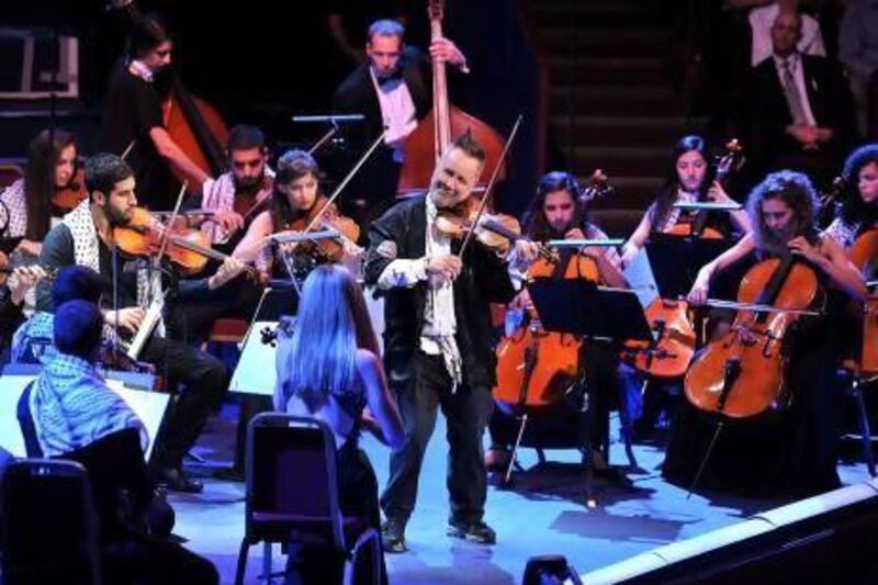 Nigel Kennedy performs with the Palestine Strings and members of the Orchestra of Life at the BBC Proms last week. Chris Christodoulou / BBC