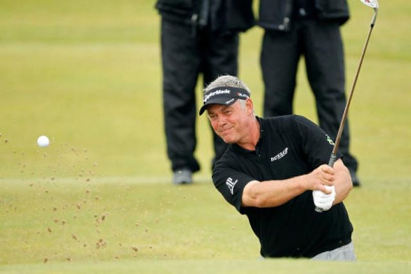 Northern Ireland's Darren Clarke hits a shot out of the bunker on the 11th hole during the final day of the  British Open Golf Championship at Royal St George's golf course Sandwich, England, Sunday, July 17, 2011. (AP Photo/Peter Morrison)