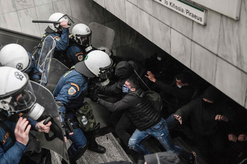 Greek riot police and protesters clash during a demonstration in support of convicted far-left hitman Dimitris Koufontinas, in Athens. He is on hunger strike after a prison transfer request was rejected. AFP