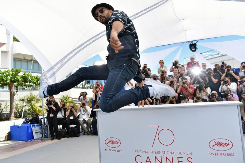 French artist and photographer JR poses for at a photo call for the film ‘Faces, Places’ (Visages, Villages) at the 70th edition of the Cannes Film Festival in Cannes, southern France. loic Venance / AFP / May 19, 2017