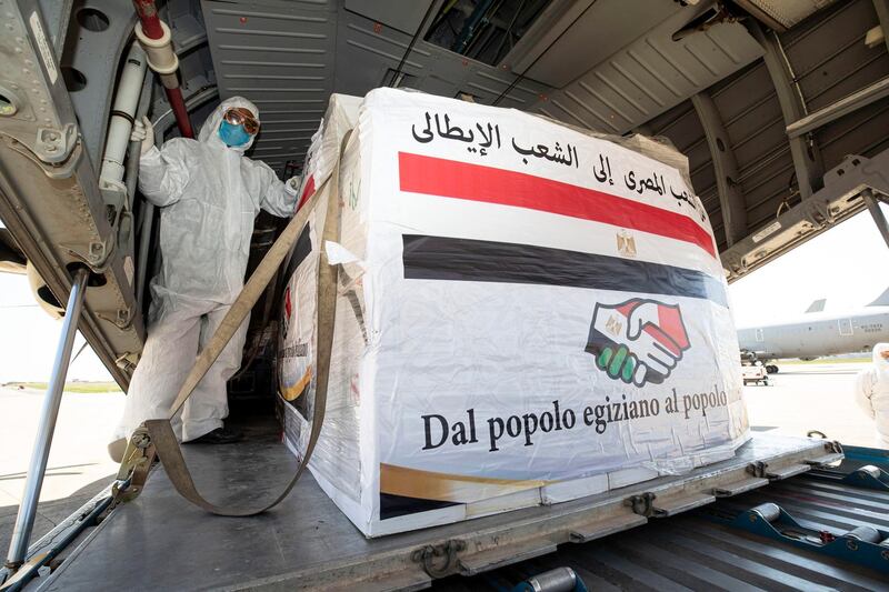 Airport staff unload medical aid sent to Italy from Egypt near Rome. EPA