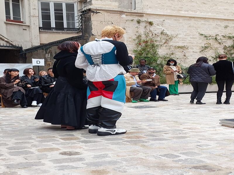 A man wearing a corset and leather trousers during Paris Fashion Week.