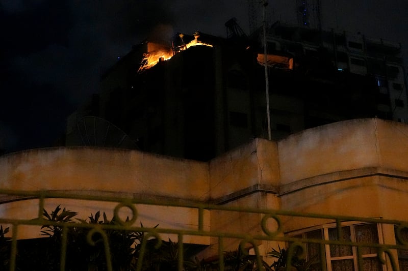 Fire burns at a Gaza city apartment. AP