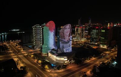 Towers in the Lusail area of ​​Doha are illuminated with the flag of Palestine and an image of Shireen Abu Akleh, who was killed covering an Israeli raid in West Bank. Photo: @anadoluagency via Twitter