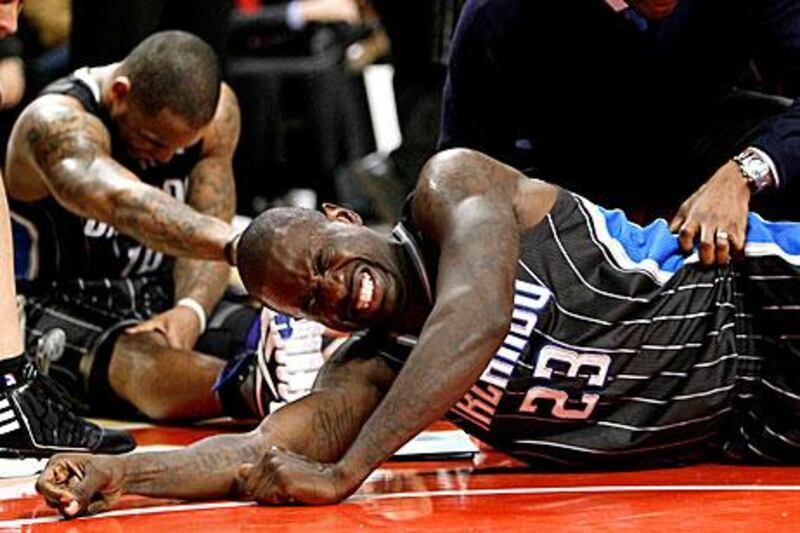 Orlando Magic guard Jason Richardson (23) grimaces as teammate Jameer Nelson recovers after a play during the second half.