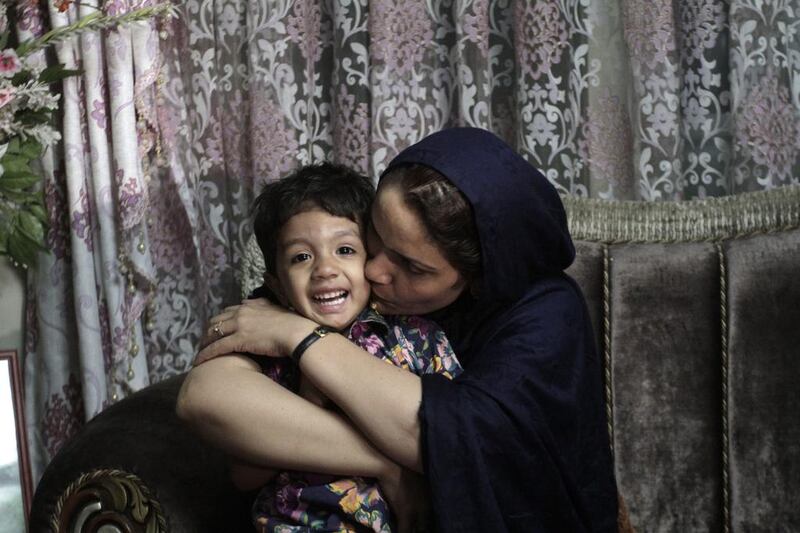 Fariba Ahmadi Kakar with her daughter in Kabul. Rahmat Gul / AP Photo
