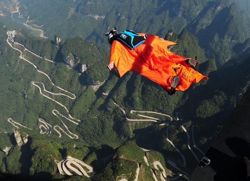 A wingsuit flying athlete shown above China's Tianmen Mountain on Friday during the Red Bull windsuit flying China Grand Prix. ChinaFotoPress / Getty Images
