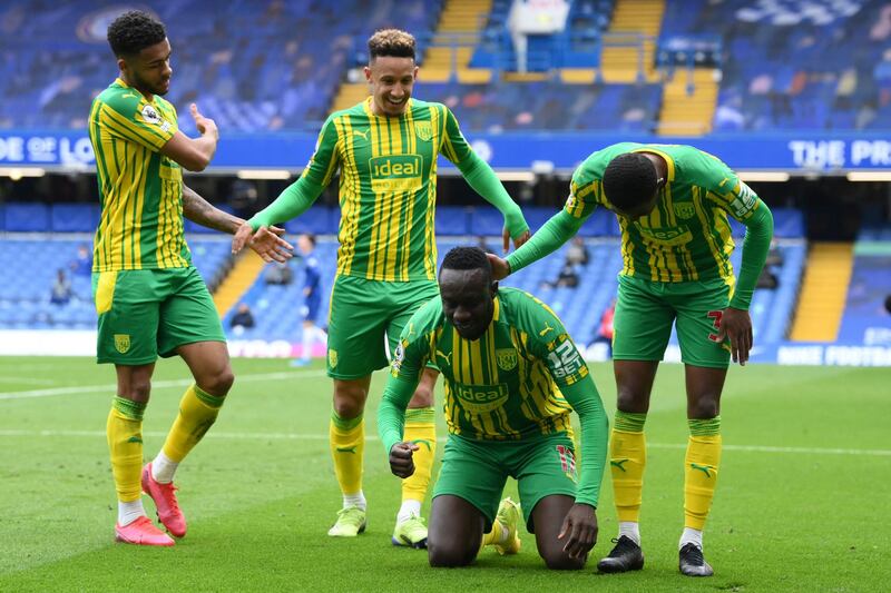 West Bromwich Albion's striker Mbaye Diagne, second right, celebrates with teammates after scoring his team's fourth goal against Chelsea. AFP