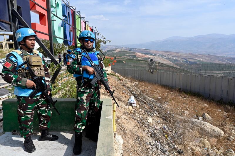 Members of the UN peacekeeping mission UNIFIL keep watch on the Israeli town of Misgav Am from Aadaysit in southern Lebanon. EPA