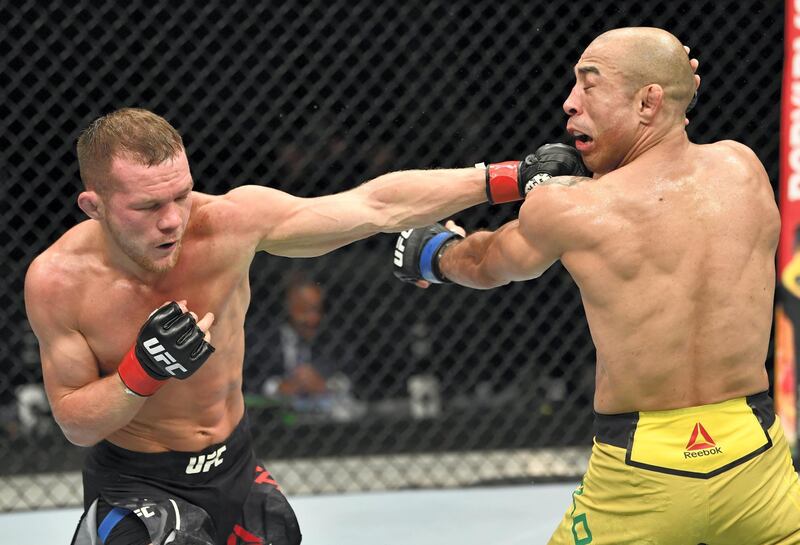 ABU DHABI, UNITED ARAB EMIRATES - JULY 12: (L-R) Petr Yan of Russia punches Jose Aldo of Brazil in their UFC bantamweight championship fight during the UFC 251 event at Flash Forum on UFC Fight Island on July 12, 2020 on Yas Island, Abu Dhabi, United Arab Emirates. (Photo by Jeff Bottari/Zuffa LLC)