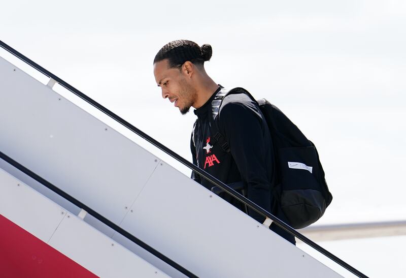 Liverpool's Virgil van Dijk boards the plane before flying out of John Lennon Airport. PA