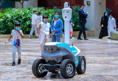 Robot security guards are on patrol at Abu Dhabi's largest mall to help keep shoppers safe during the Covid-19 pandemic. Victor Besa / The National