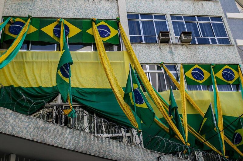 View of a window from a Rio de Janeiro building decorated with Brazilian flags ahead of the 2014 World Cup. Antonio Lacerda / EPA / June 4, 2014