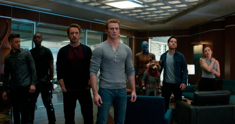 This image released by Disney shows, from left, Jeremy Renner, Don Cheadle, Robert Downey Jr., Chris Evans, Karen Gillan, the character Rocket, voiced by Bradley Cooper, Paul Rudd and Scarlett Johansson in a scene from â€œAvengers: Endgame.â€ (Disney/Marvel Studios via AP)