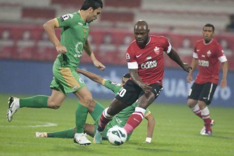 Achillie Emana, centre, scored four goals for Al Ahli but has become surplus to their needs. Mike Young / The National