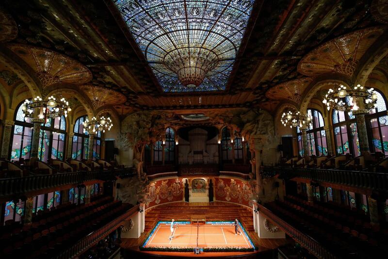 Spain's Rafael Nadal plays against Japan's Kei Nishikori during a promotional tennis match at the Palau de la Musica in Barcelona.  AFP