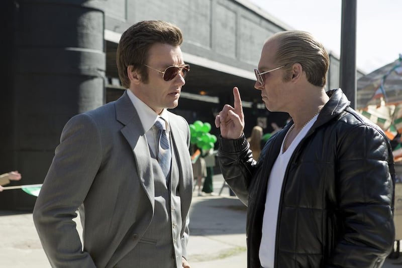 Joel Edgerton, left, portrays FBI agent John Connolly and Johnny Depp is Whitey Bulger in the Boston-set film Black Mass. Claire Folger/Warner Bros. Entertainment via AP