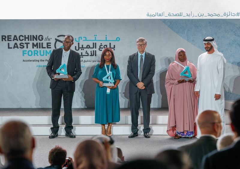 Abu Dhabi, United Arab Emirates, November 19 , 2019.  
Reaching the Last Mile Forum.
Recipients of the Reach awards at the Reaching the Last Mile forum at Louvre Abu Dhabi on Tuesday.
(L-R) Richard Kojan, Olivia Ngou and Rahane Lawal worked to tackle polio, Ebola and malaria with Bill Gates and H.E. Sheikh Mohamed bin Zayed, Crown Prince of Abu Dhabi and Deputy Supreme Commander of the UAE.
Victor Besa / The National
Section:  NA
Reporter:  Dan Sanderson
