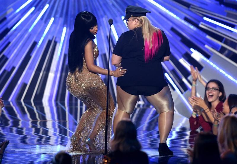 Presenter Rebel Wilson, right, dances with Nicki Minaj as Minaj arrives on stage to accept the award for hip-hop video of the year at the MTV Video Music Awards. Matt Sayles / Invision / AP