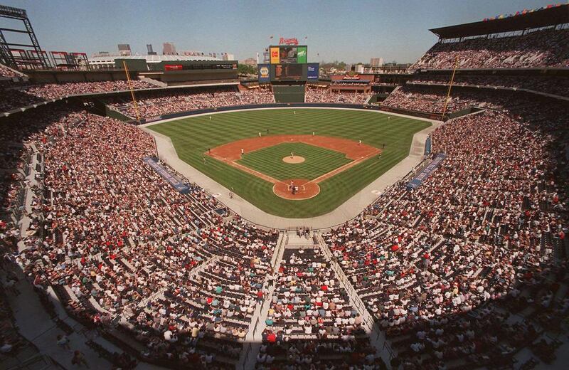 This is a March 29, 1997 file photo of  baseball fans as they fill the stands as the Atlanta Braves play an exhibition game against the New York Yankess, the first baseball game ever to be played in the new Turner Field in Atlanta. Converting the Olympic Stadium to a baseball park helped to keep the Braves in downtown Atlanta. After the 1996 games, the Olympics stadium was converted into Turner Field, the baseball stadium that’s been home to the Atlanta Braves for the past several years (AP Photo/Ric Feld, File)