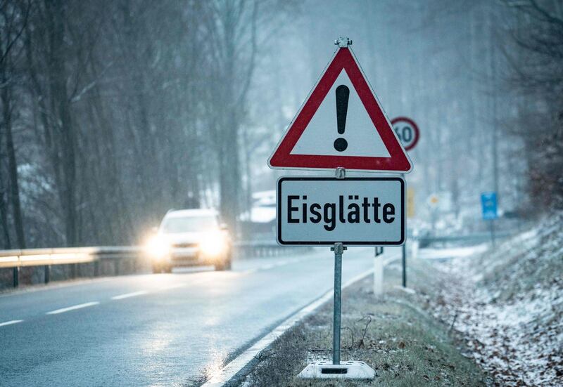 A street sign reading "Black Ice" stands at a street in Oberreifenberg. AFP