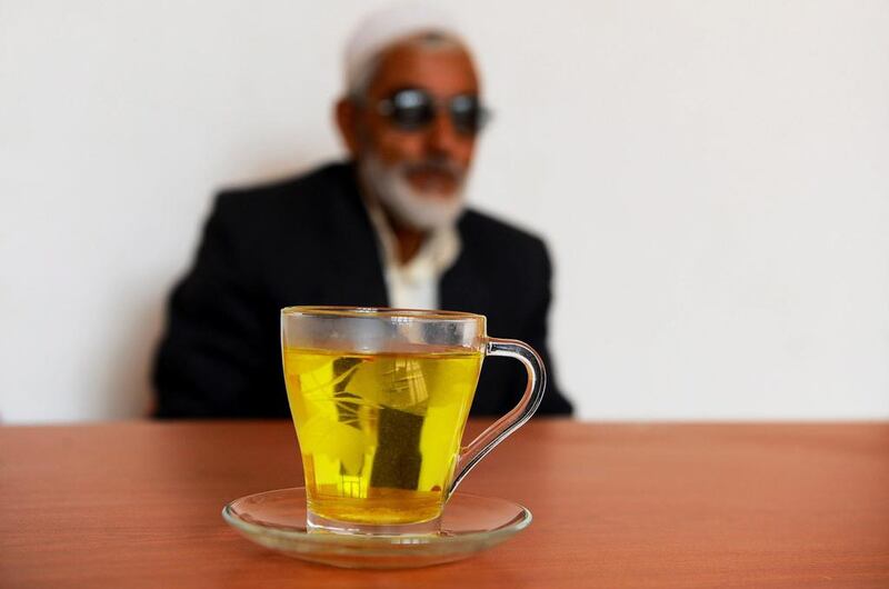 An Afghan resident enjoys a saffron tea in Herat.