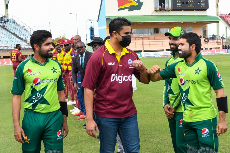 Babar Azam, left, introduces Mohammad Rizwan and Shadab Khan to Charles Ramson, Minister of Sports in Guyana.