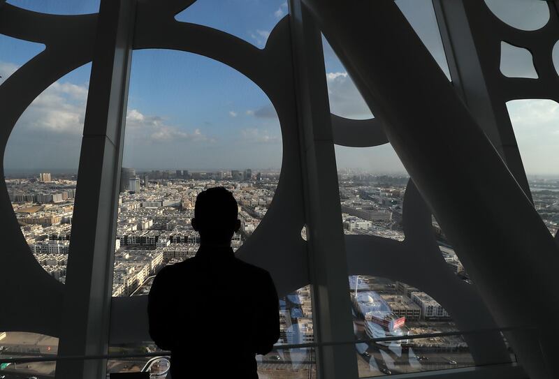 DUBAI , UNITED ARAB EMIRATES , November 24 – 2020 :- Visitor looking the cloudy weather from Dubai Frame in Dubai. ( Pawan Singh / The National ) For News/Standalone/Instagram/Big Picture