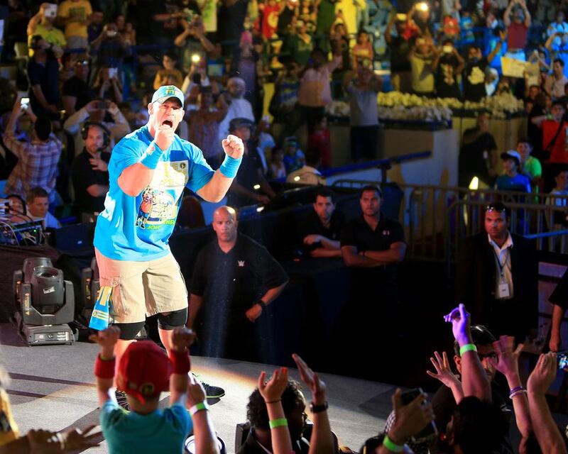 John Cena, cheers the fans before the fight during a Intercontinental Championship match the main event of WWE Live at Zayed Sports City yesterday in Abu Dhabi. Ravindranath / The National