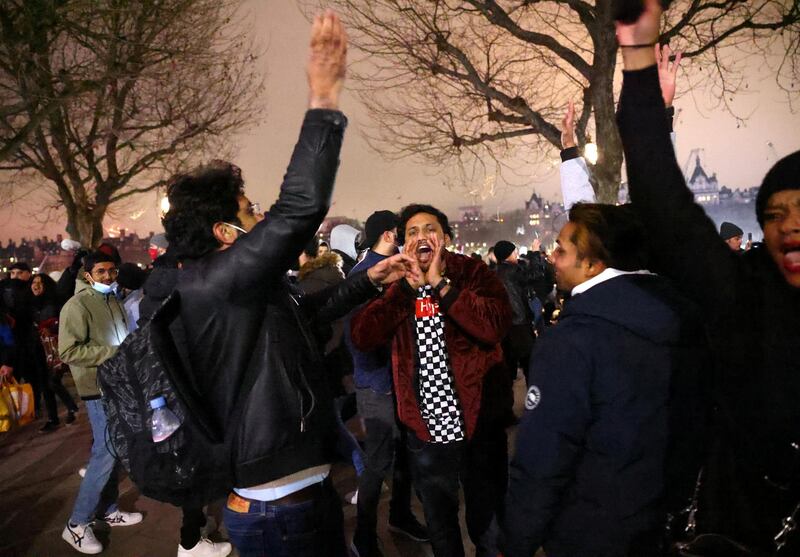 People are seen during an anti-lockdown protest on the South Bank in London. Reuters