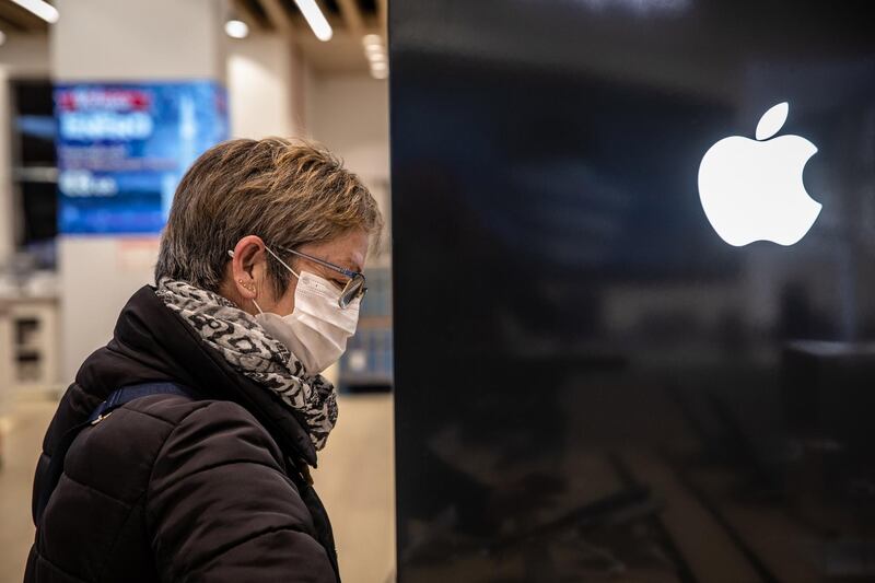 A shopper browses an Apple Inc. product display inside the AliExpress plaza retail store, operated by Alibaba Group Holding Ltd., in Barcelona, Spain, on Wednesday, Jan. 13, 2020. U.S. officials deliberated but ultimately decided against banning American investment in Alibaba and Tencent Holdings Ltd., a person familiar with the discussions said, removing a cloud of uncertainty over Asia’s two biggest corporations. Photographer: Angel Garcia/Bloomberg