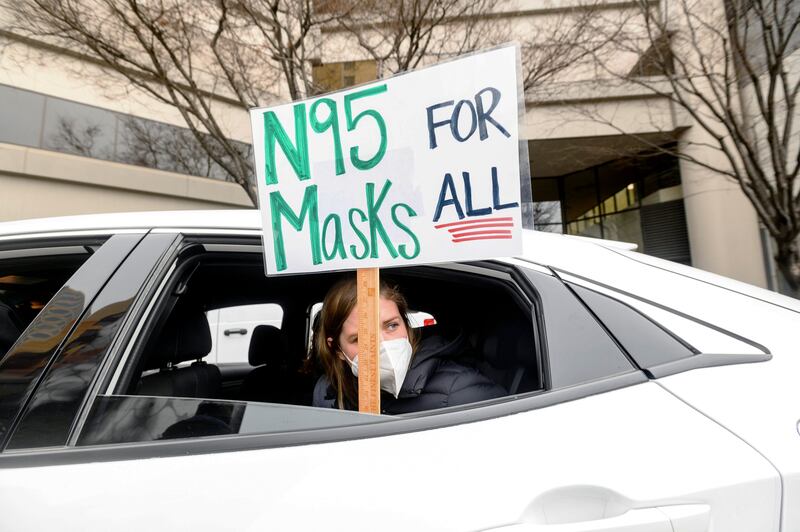 Elementary school teacher Carrie Landheer protests for stronger Covid-19 safety protocols in Oakland, California. AP