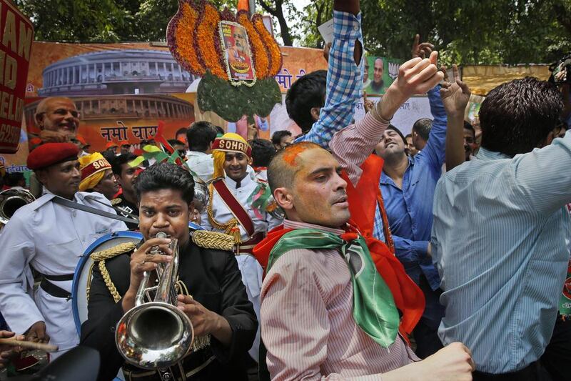 People celebrate the BJP win in New Delhi. The last time any single party won a majority in India was in 1984, when an emotional nation gave the Congress party a staggering victory of more than 400 seats. AP Photo / May 16, 2014