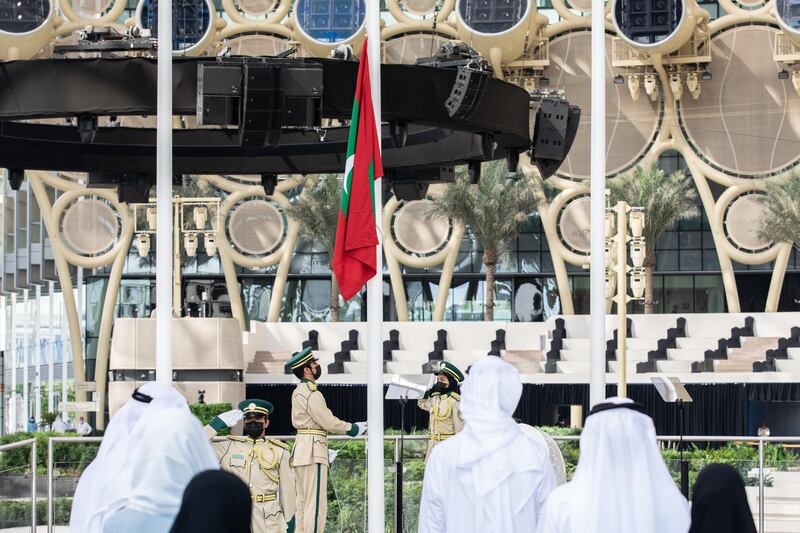 The Maldives flag is raised during the country's national day ceremony in Al Wasl Plaza at Expo 2020 Dubai. Photo: Omar Marques / Expo 2020 Dubai