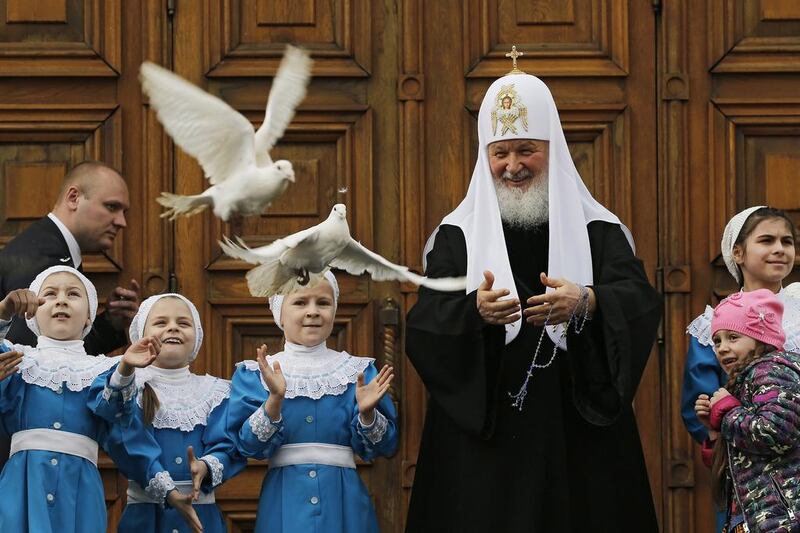 Russian Orthodox Patriarch Kirill releases white doves to mark Annunciation Day in the Kremlin in Moscow, Russia. Annunciation is one of 12 main holidays of Christianity and celebrates the Annunciation of the Blessed Virgin Mary by archangel Gabriel that she will give birth to Jesus Christ. Yuri Kochetkov / EPA / April 7, 2017