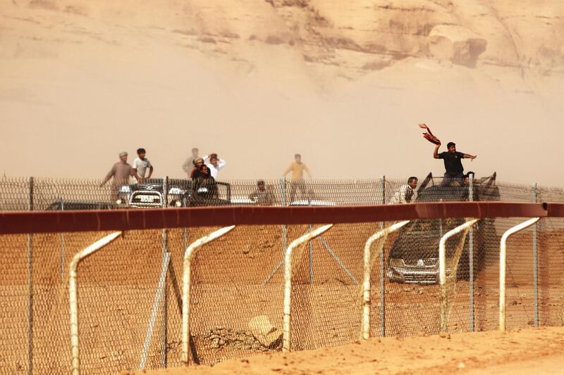 Jordanian Bedouins prepare to race camels using robotic jockeys at the Sheikh Zayed track in the town of al-Disi in the desert of Wadi Rum valley, on November 9, 2019. (The National)