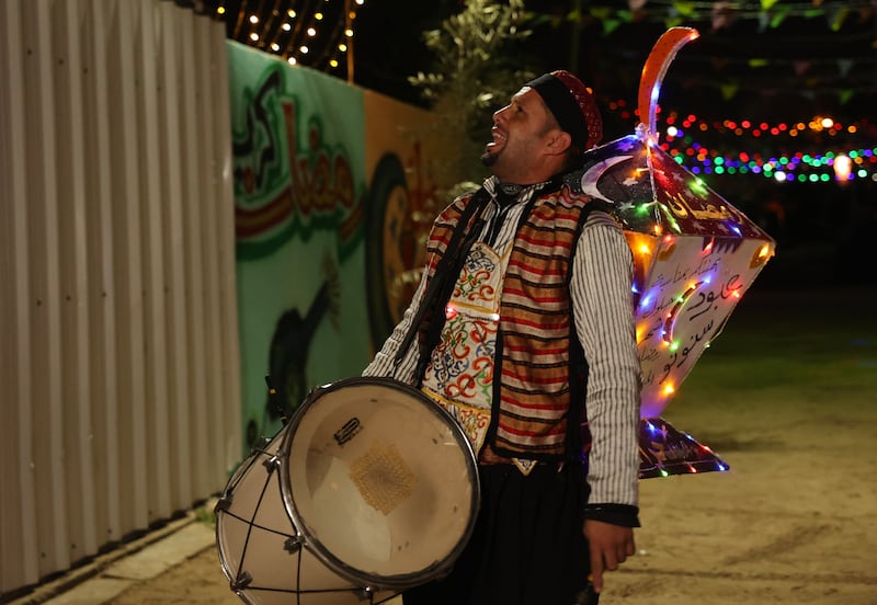 A Palestinian drummer walks through the streets of Rafah in the southern Gaza Strip on the first night of Ramadan. AFP